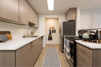 Kitchen with white countertops and stainless appliances